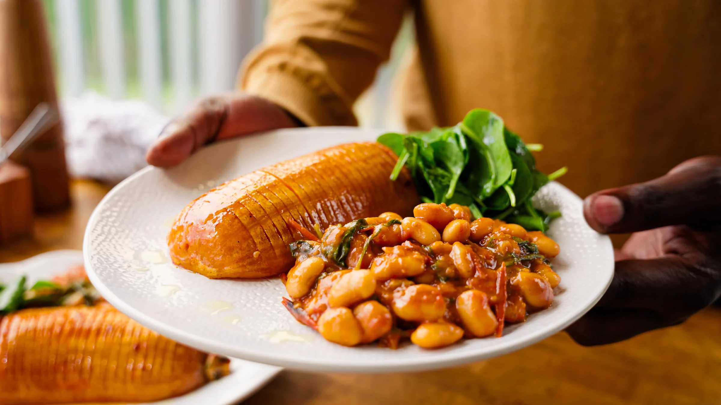 Creamy butter beans with roasted tomatoes and hasselback butternut squash.