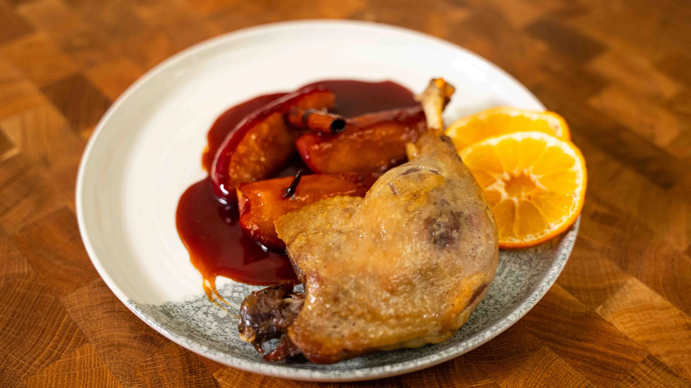 Duck leg confit with caramelized apples.
