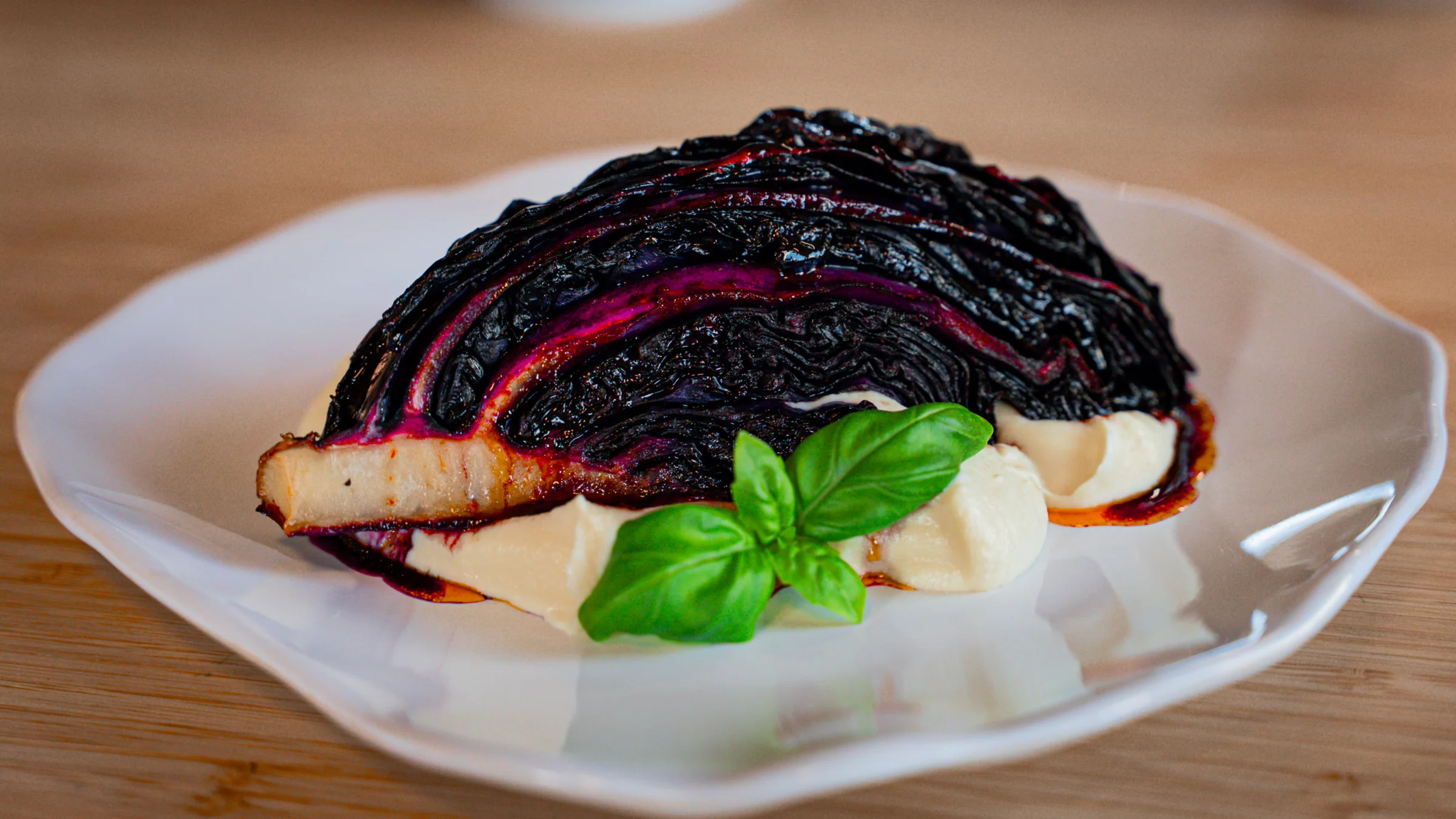 Roasted red cabbage with a rich cherry glaze, caramelized in the oven and served with a silky cauliflower purée.