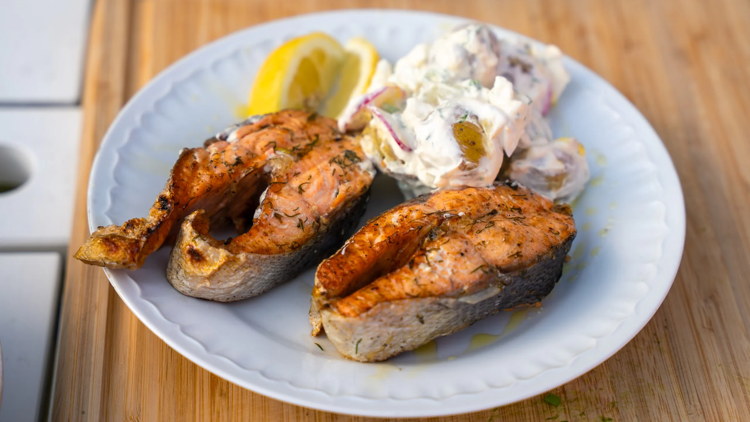 Grilled salmon with potato salad.